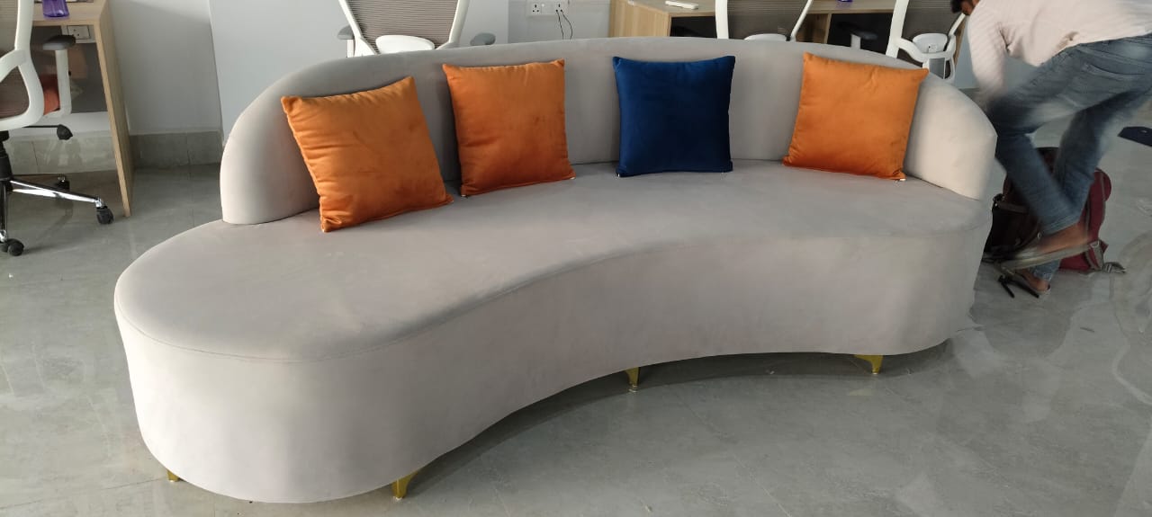 Curved grey sofa