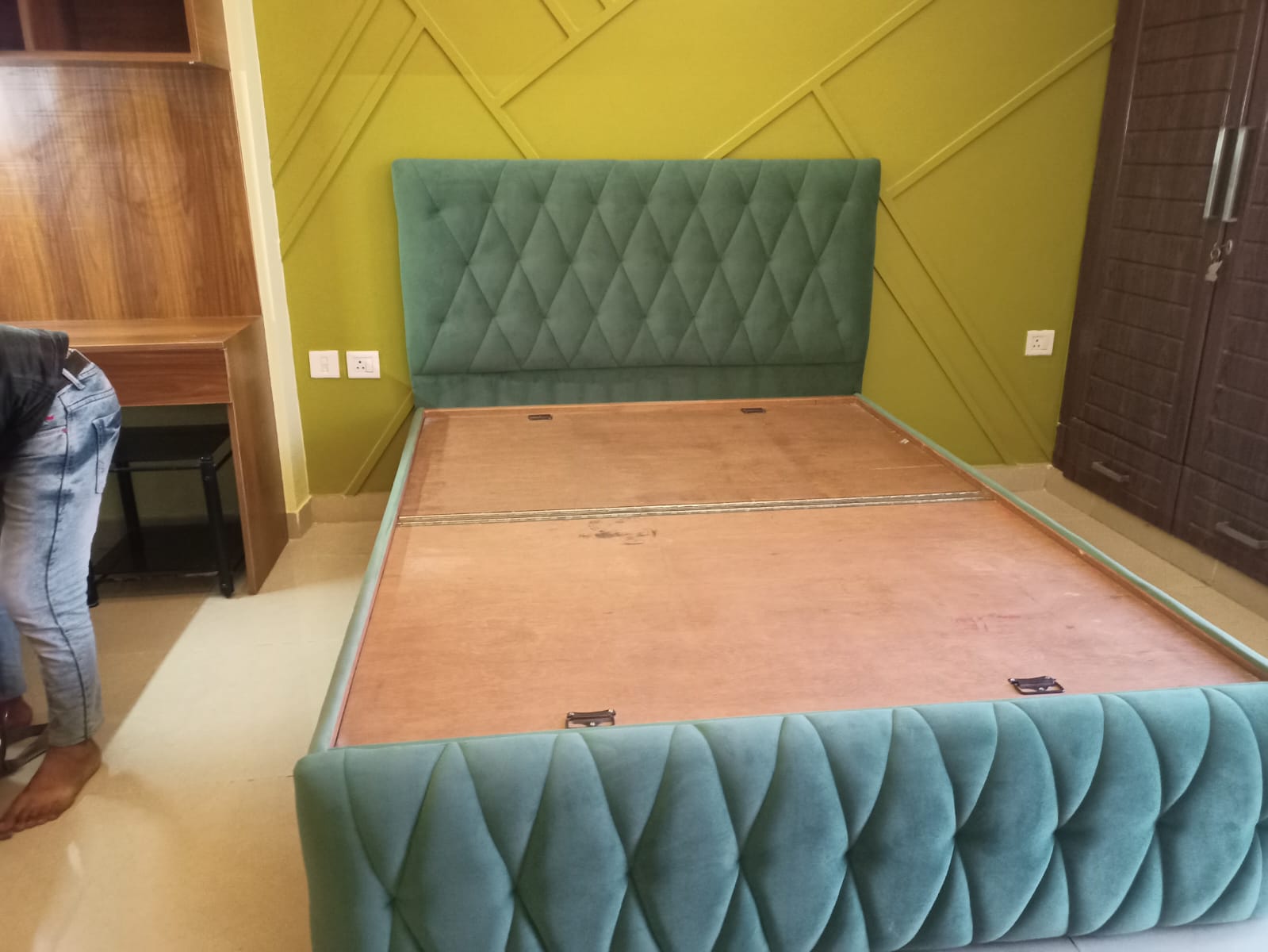 Green tufted bed headboard